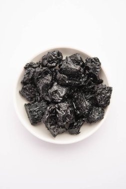 Shilajit is an ayurvedic medicine found primarily in the rocks of the Himalayas. selective focus