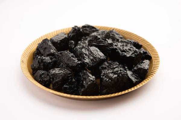 Shilajit is an ayurvedic medicine found primarily in the rocks of the Himalayas. selective focus