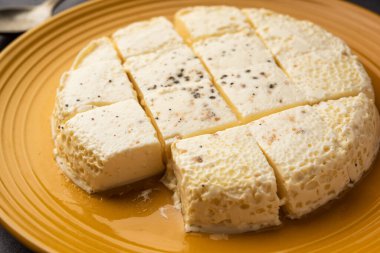 Kharvas or Cheek, Chik, Bari, Pis or Junnu is a sweet dairy product made from bovine colostrum