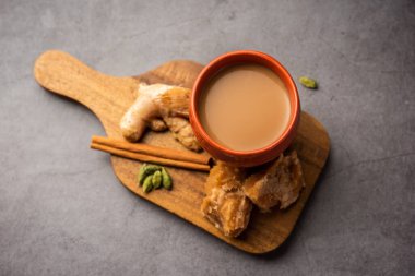 Jaggery tea or Gur ki chai with ingredients like gud, ginger or adrak, green cardamom and cinnamon