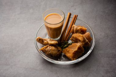 Jaggery tea or Gur ki chai with ingredients like gud, ginger or adrak, green cardamom and cinnamon