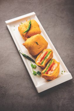 Ulta Vada Pav is made with a spicy potato stuffed bun, called pav inside vada, inside out wada pao