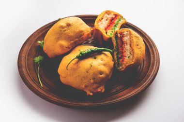 Ulta Vada Pav is made with a spicy potato stuffed bun, called pav inside vada, inside out wada pao