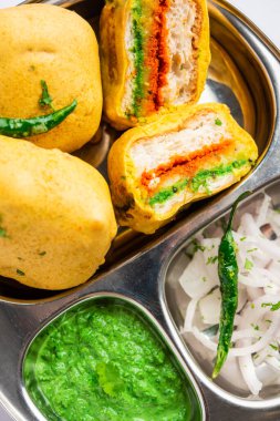 Ulta Vada Pav is made with a spicy potato stuffed bun, called pav inside vada, inside out wada pao