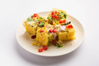 Khaman Dhokla chaat is a very simple and refreshing fusion chaat recipe made using leftover dhokla