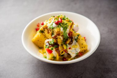 Khaman Dhokla chaat is a very simple and refreshing fusion chaat recipe made using leftover dhokla
