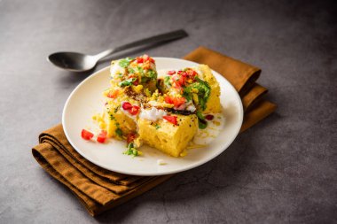 Khaman Dhokla chaat is a very simple and refreshing fusion chaat recipe made using leftover dhokla