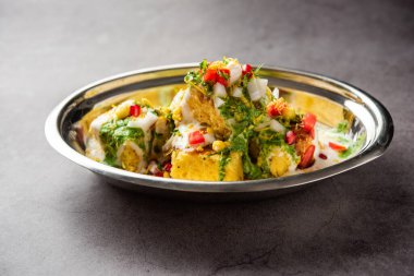 Khaman Dhokla chaat is a very simple and refreshing fusion chaat recipe made using leftover dhokla