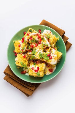 Khaman Dhokla chaat is a very simple and refreshing fusion chaat recipe made using leftover dhokla