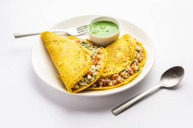 Paneer stuffed Besan chilla or Cheela made using chickpea flour with cottage cheese stuffing