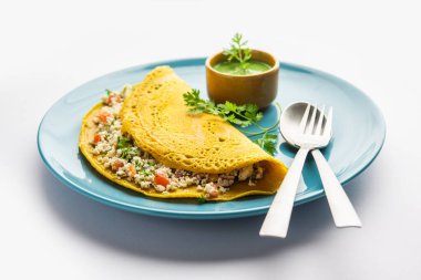 Paneer stuffed Besan chilla or Cheela made using chickpea flour with cottage cheese stuffing