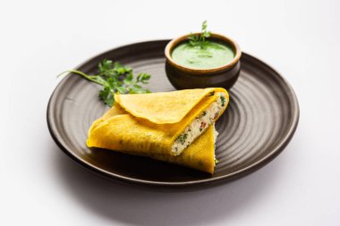 Paneer stuffed Besan chilla or Cheela made using chickpea flour with cottage cheese stuffing