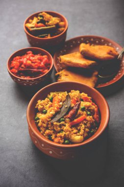 Bengali Bhog food for Indian Hindu Durga Puja or pooja festival. Khichadi, labra, tomato chutney