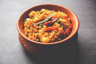 Bengali dish khichdi or khichuri made from a combination of lentils and rice and vegetables