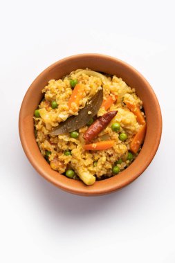 Bengali dish khichdi or khichuri made from a combination of lentils and rice and vegetables