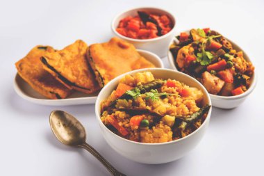Bengali Bhog food for Indian Hindu Durga Puja or pooja festival. Khichadi, labra, tomato chutney