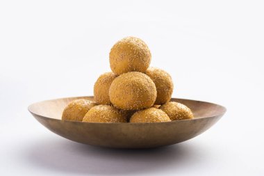 Khas khas besan laddu or poppy seeds and chickpea flour laddo or laddoo clipart