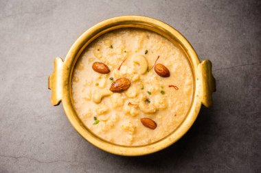 Nolen Gurer Chanar Payesh ya da süzme peynirli sütlü puding, pilav ve jaggery, bengali tatlı tarifi