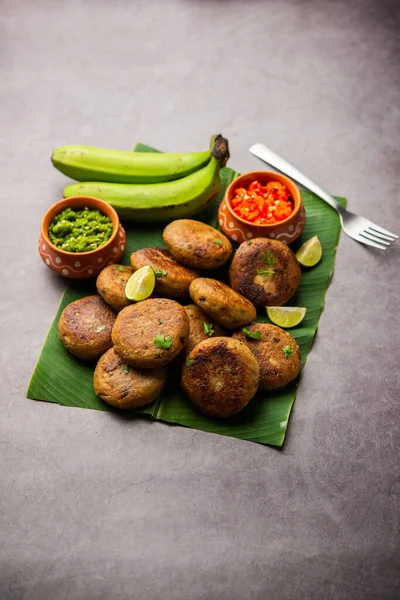 Raw Banana Cutlet also called plantain or kacche kele ki tikki or patties, served with chutney
