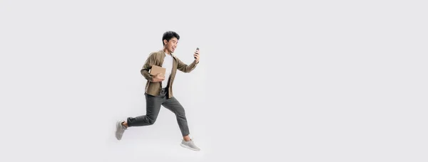 Full Length Handsome Asian Man Holding Box Use Smartphone Run — 스톡 사진