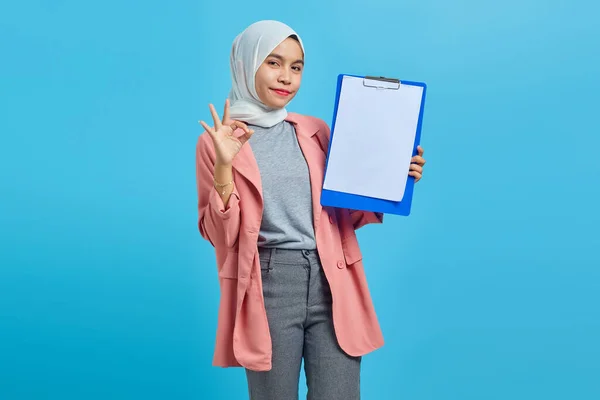 Portrait Beautiful Cheerful Asian Woman Holding Clipboard Making Gesture Isolated — Stock Photo, Image