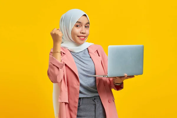 Portrait Cheerful Asian Woman Holding Laptop Celebrating Success Isolated Yellow — Stock Photo, Image