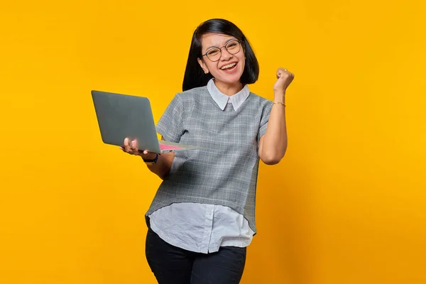 Portrait Excited Asian Woman Holding Laptop Yellow Background — Stock Photo, Image