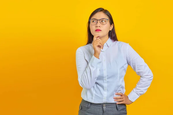 Pensive Young Beautiful Business Woman Rubs Chin Thinking Question Yellow — Stock Photo, Image