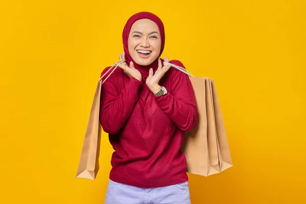 Portrait Cheerful Beautiful Asian Woman Holding Shopping Bags Yellow Background — Stok Foto