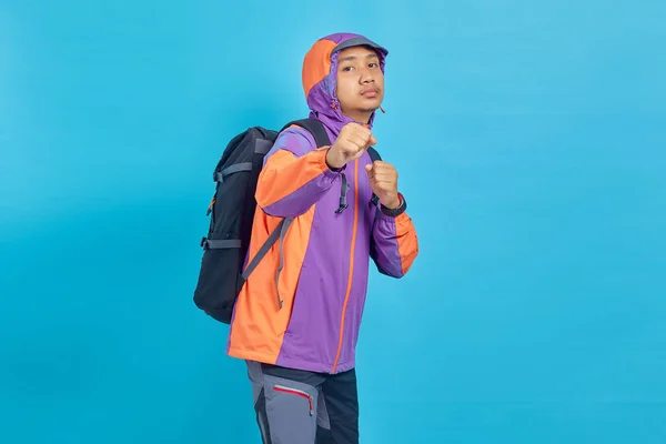 Portrait Angry Young Asian Man Showing Boxer Gesture Blue Background — Stockfoto