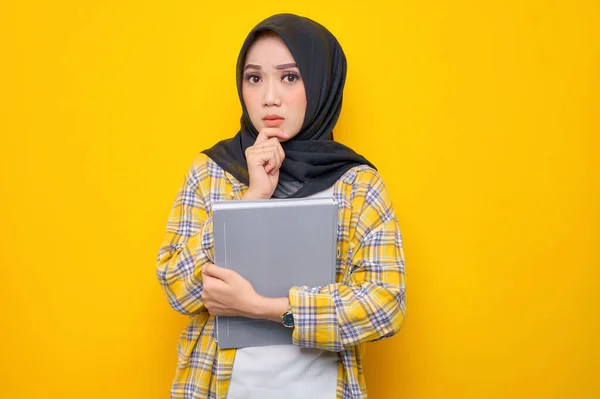 Pensive Young Asian Muslim Student Holding Book Looks Seriously Thinking — Stock Fotó