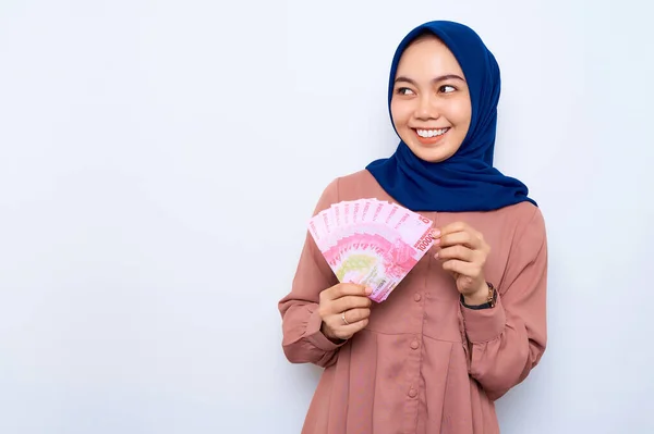 Smiling Young Asian Muslim Woman Pink Shirt Holding Money Banknotes — стоковое фото