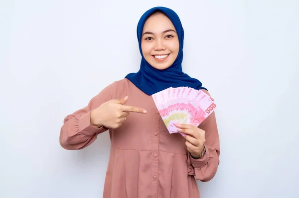 Excited Young Asian Muslim Woman Pink Shirt Point Money Banknotes — Zdjęcie stockowe