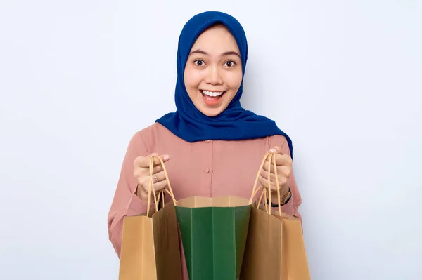 Cheerful Young Asian Muslim Woman Pink Shirt Opening Package Bags — Stok Foto