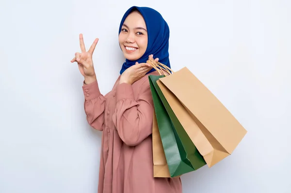 Cheerful Young Asian Muslim Woman Pink Shirt Holding Package Bags — Foto Stock