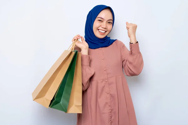 Excited Young Asian Muslim Woman Pink Shirt Holding Package Bags — стоковое фото