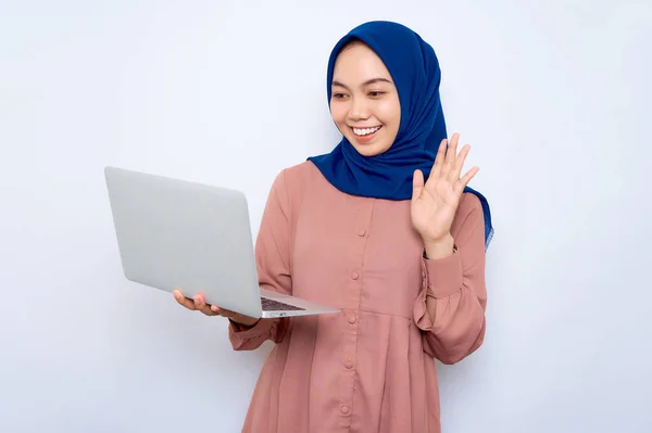 Cheerful Young Asian Muslim Woman Pink Shirt Waving Hand Laptop — Stock Fotó