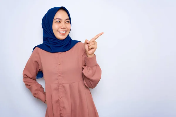 Cheerful Young Asian Muslim Woman Pink Shirt Pointing Fingers Copy — 图库照片