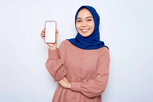 Smiling Young Asian Muslim Woman Pink Shirt Showing Mobile Phone — стоковое фото