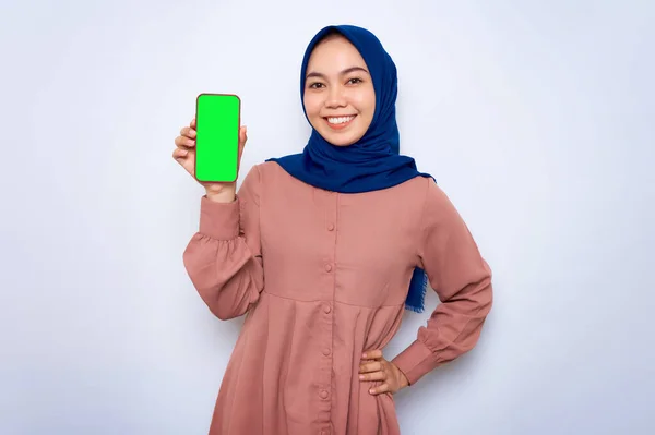 Smiling Young Asian Muslim Woman Pink Shirt Showing Mobile Phone — стоковое фото