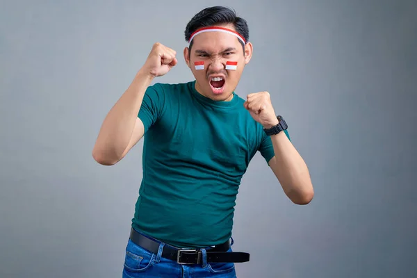 Excited Young Asian Man Celebrating Indonesian Independence Day Isolated Grey — Stockfoto