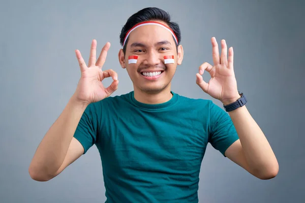 Smiling Young Asian Man Showing Sign Celebrating Indonesia Independence Day — стокове фото