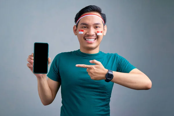 Cheerful Young Asian Man Casual Shirt Pointing Fingers Blank Screen — Stok fotoğraf