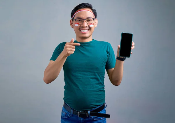 Smiling Young Asian Man Casual Shirt Showing Blank Screen Mobile — Stockfoto