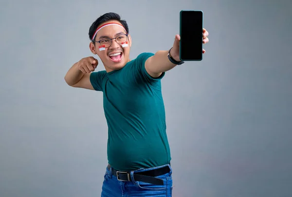 Excited Young Asian Man Casual Shirt Showing Blank Screen Mobile — Stok fotoğraf