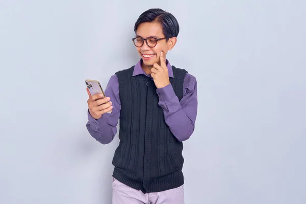 Smiling Young Asian Man Casual Shirt Holding Mobile Phone Thinking — Stock Photo, Image