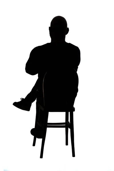 Rückansicht Der Silhouette Eines Mannes Der Auf Einem Stuhl Sitzt — Stockfoto