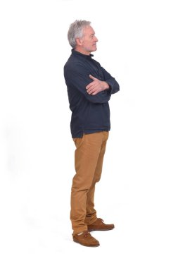 side view of a manarms crossed on white background