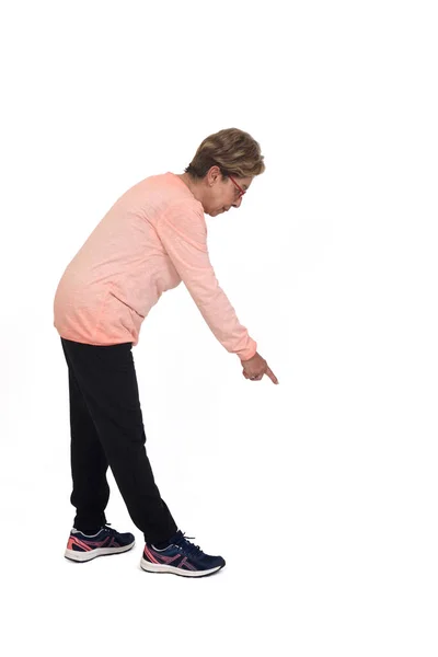 Senior Woman Loooking Pointing Floor White Background — Stock Photo, Image