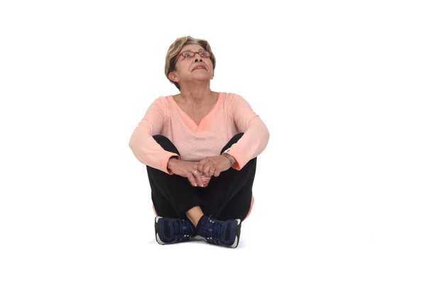 Front View Senior Woman Sitting Floor Look White Background — 스톡 사진
